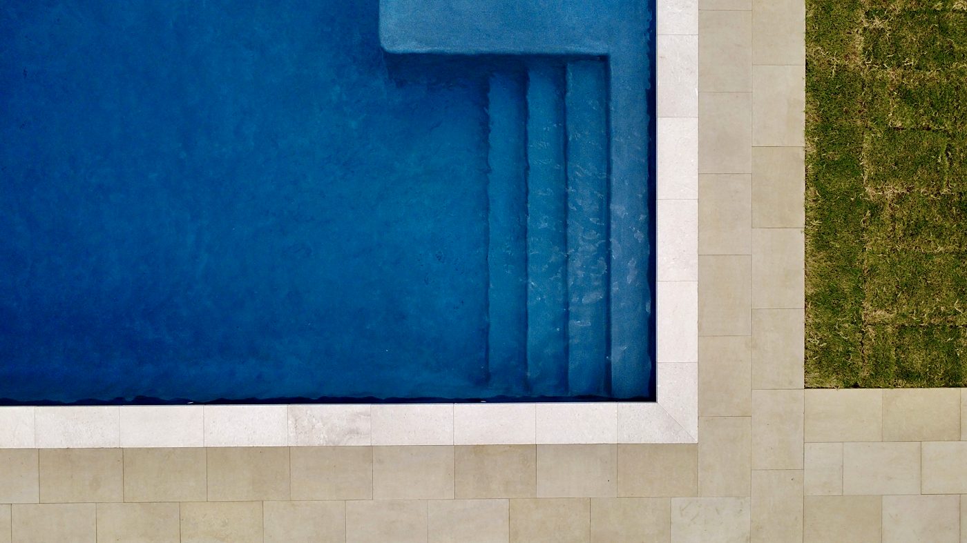 Aerial view of pool steps and coping